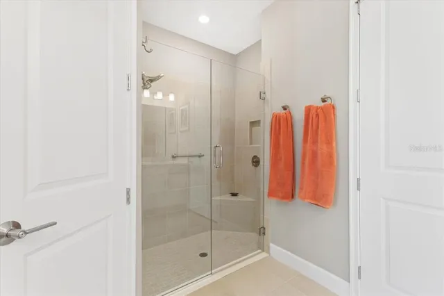 a bathroom with a shower and a sink