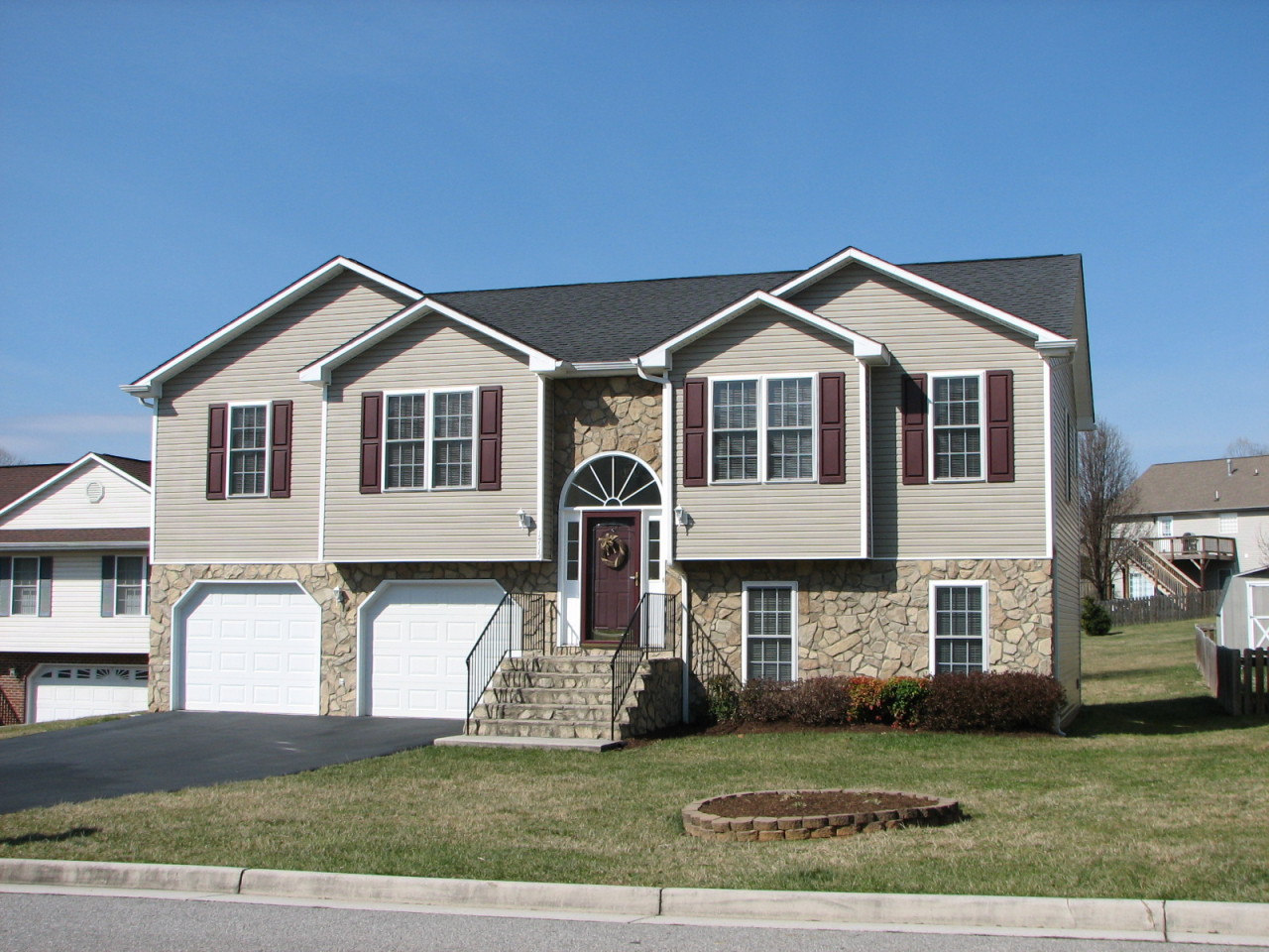 a front view of a house with a garden