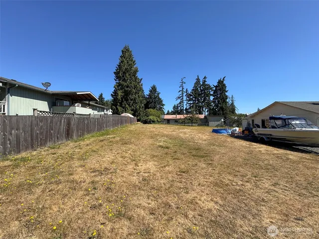 a backyard of a house with lots of green space