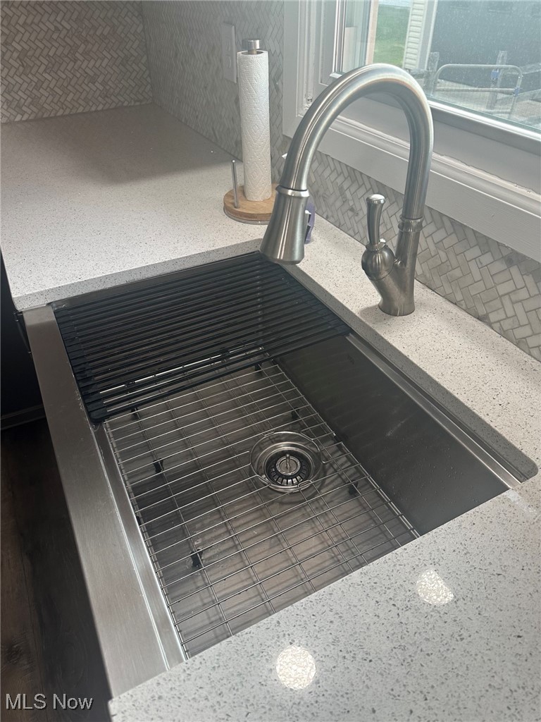 2276 Schellin Road Wooster, OH 44691 - Photo 11 of 48 Kitchen view of a sink and backsplash