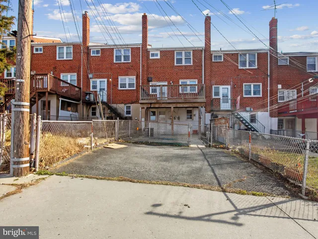a view of a brick building with many windows