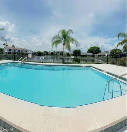 a view of a swimming pool and outdoor space