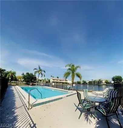 a lake with palm trees