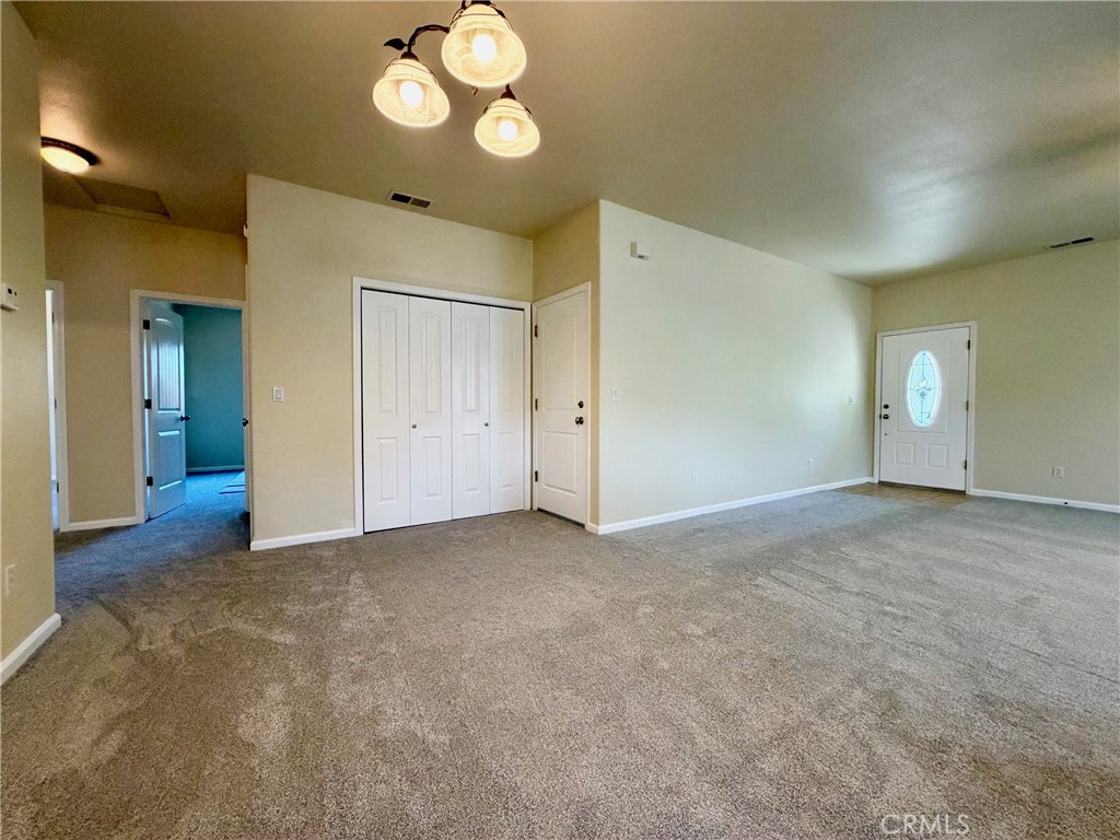 1037 Mark Twain Road Angels Camp, CA 95222 - Photo 22 of 52 an empty room with a mirror and a fan
