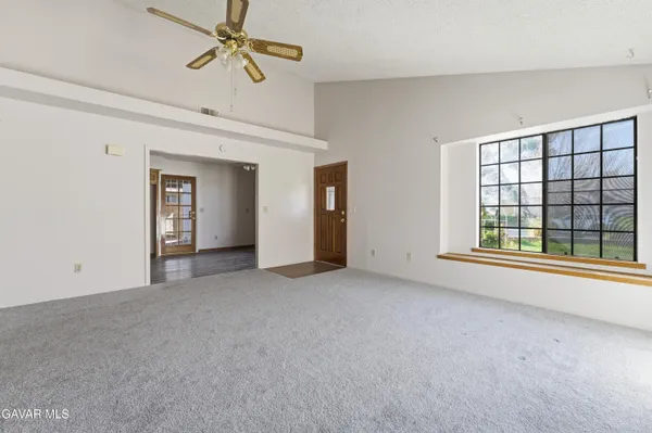 a view of empty room with windows