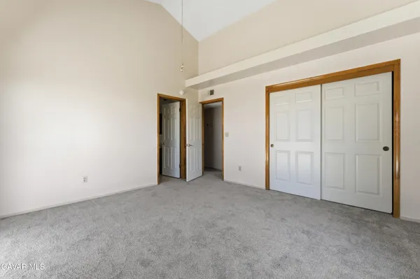 an empty room with closet area