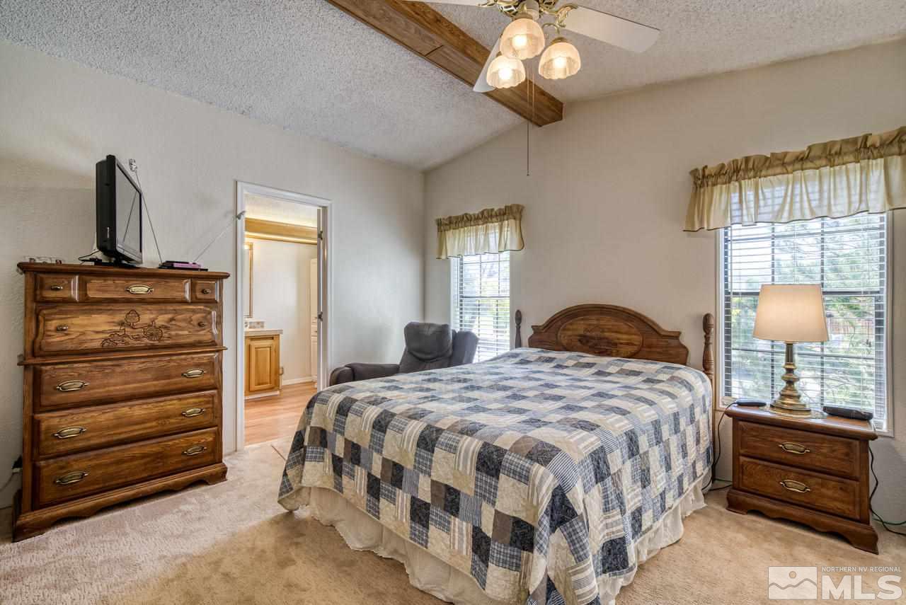 15030 Vega Street Reno, NV 89521 - Photo 16 of 29 a bedroom with a bed and a window