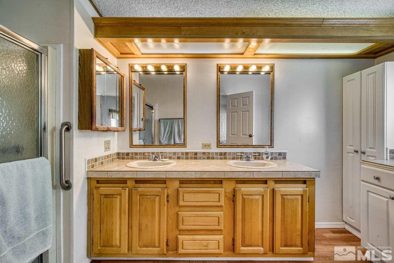 15030 Vega Street Reno, NV 89521 - Photo 17 of 29 a bathroom with a sink and a mirror