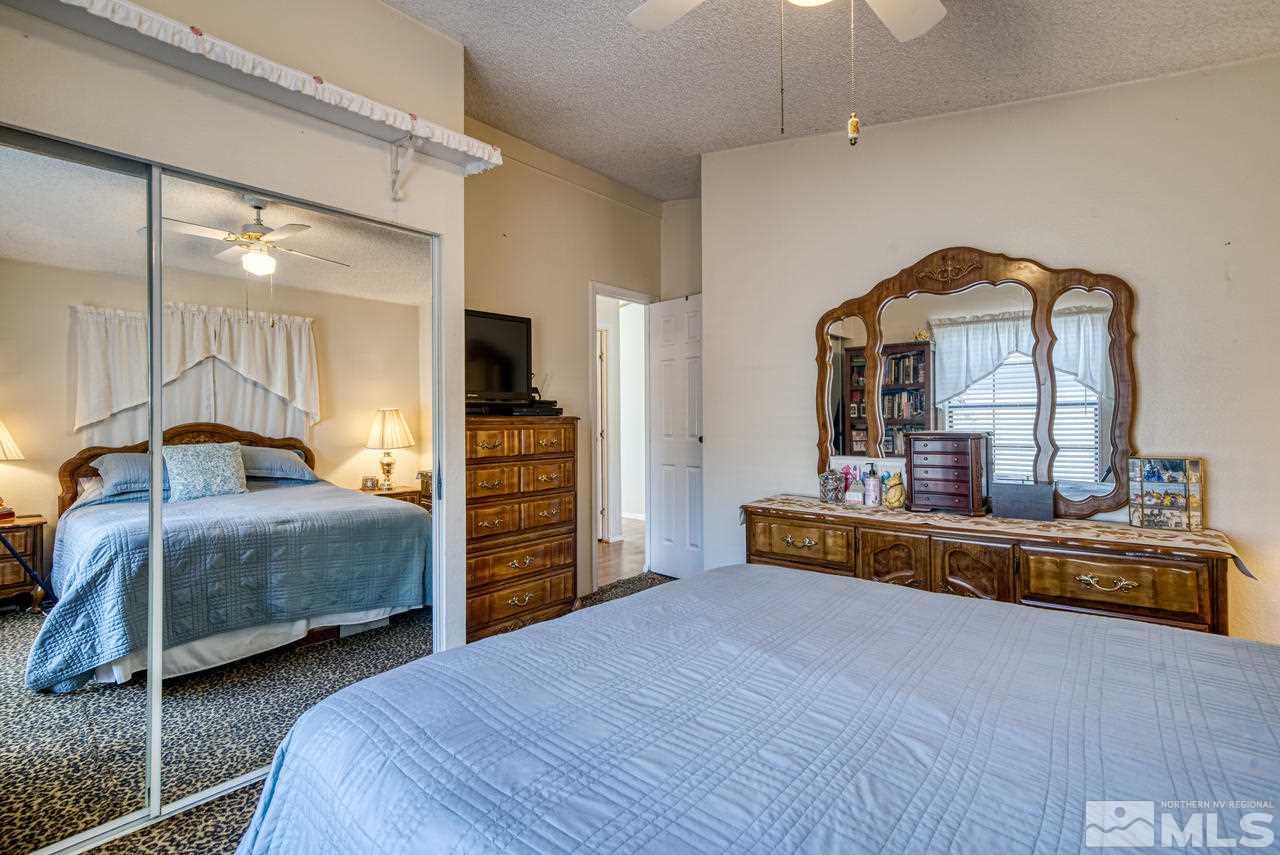 15030 Vega Street Reno, NV 89521 - Photo 24 of 29 a bedroom with a bed and a large dresser