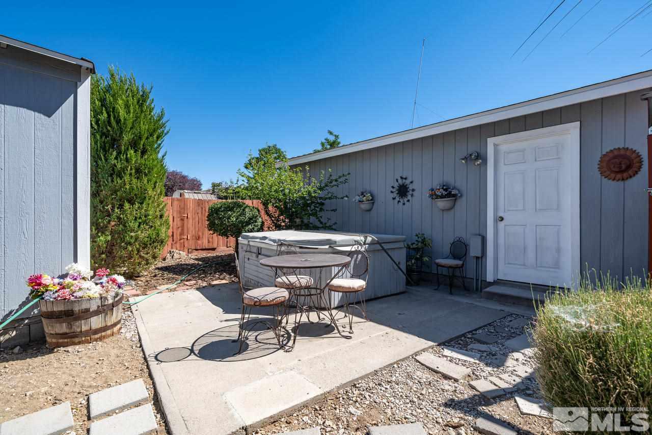 15030 Vega Street Reno, NV 89521 - Photo 26 of 29 a view of a backyard with sitting area