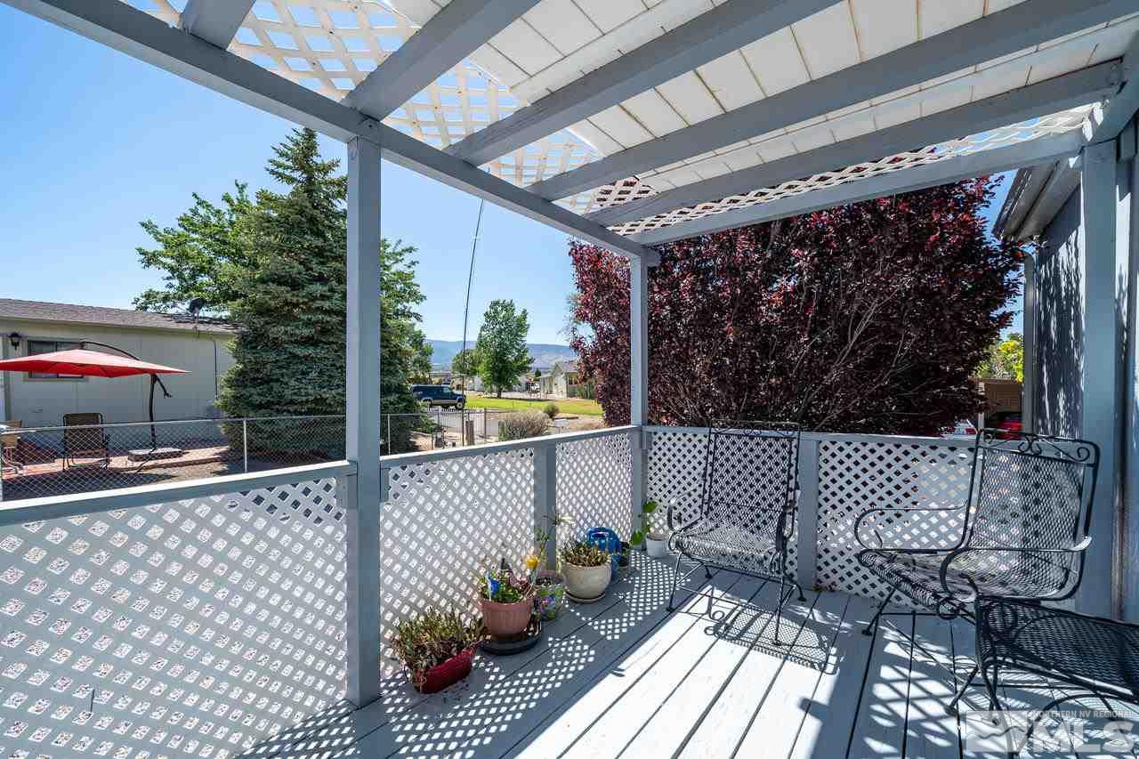 15030 Vega Street Reno, NV 89521 - Photo 3 of 29 a outdoor space with lots of furniture and white walls