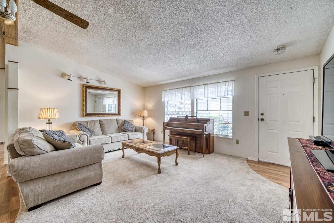 15030 Vega Street Reno, NV 89521 - Photo 4 of 29 a living room with furniture and a window
