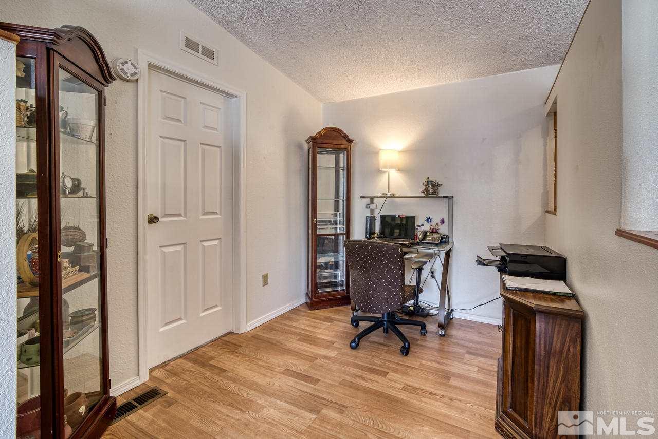 15030 Vega Street Reno, NV 89521 - Photo 6 of 29 a view of a workspace with furniture and a window