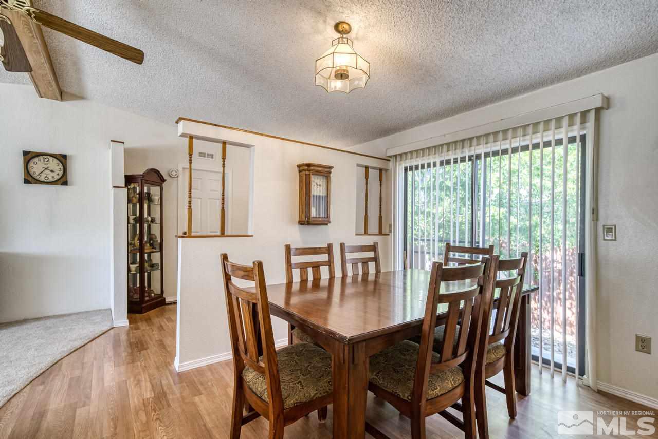 15030 Vega Street Reno, NV 89521 - Photo 8 of 29 a view of a dining room with furniture window and wooden floor