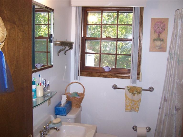 157 Compass Circle Hyannis, MA 02601 - Photo 12 of 21 a bathroom with a sink mirror and window