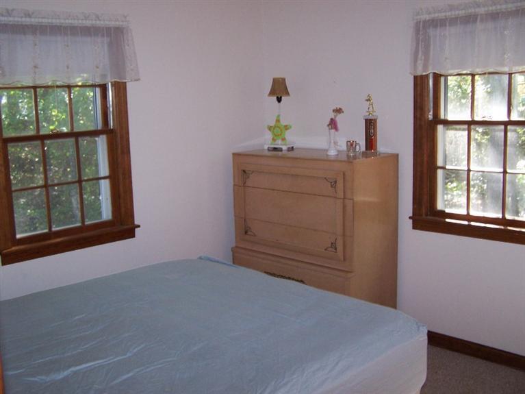 157 Compass Circle Hyannis, MA 02601 - Photo 13 of 21 a bedroom with a bed and window