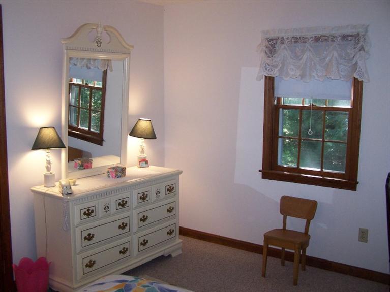 157 Compass Circle Hyannis, MA 02601 - Photo 16 of 21 a bedroom with a bed and a window