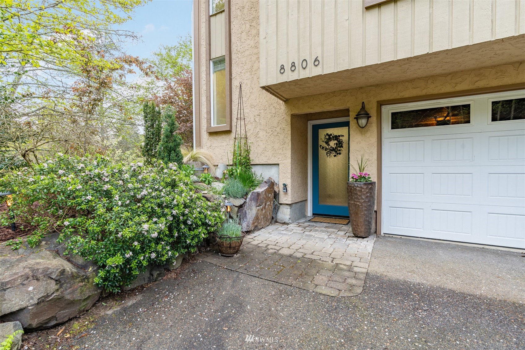8806 Shell Place, Unit 100L Edmonds, WA 98026 - Photo 4 of 25 a view of a house with potted plants
