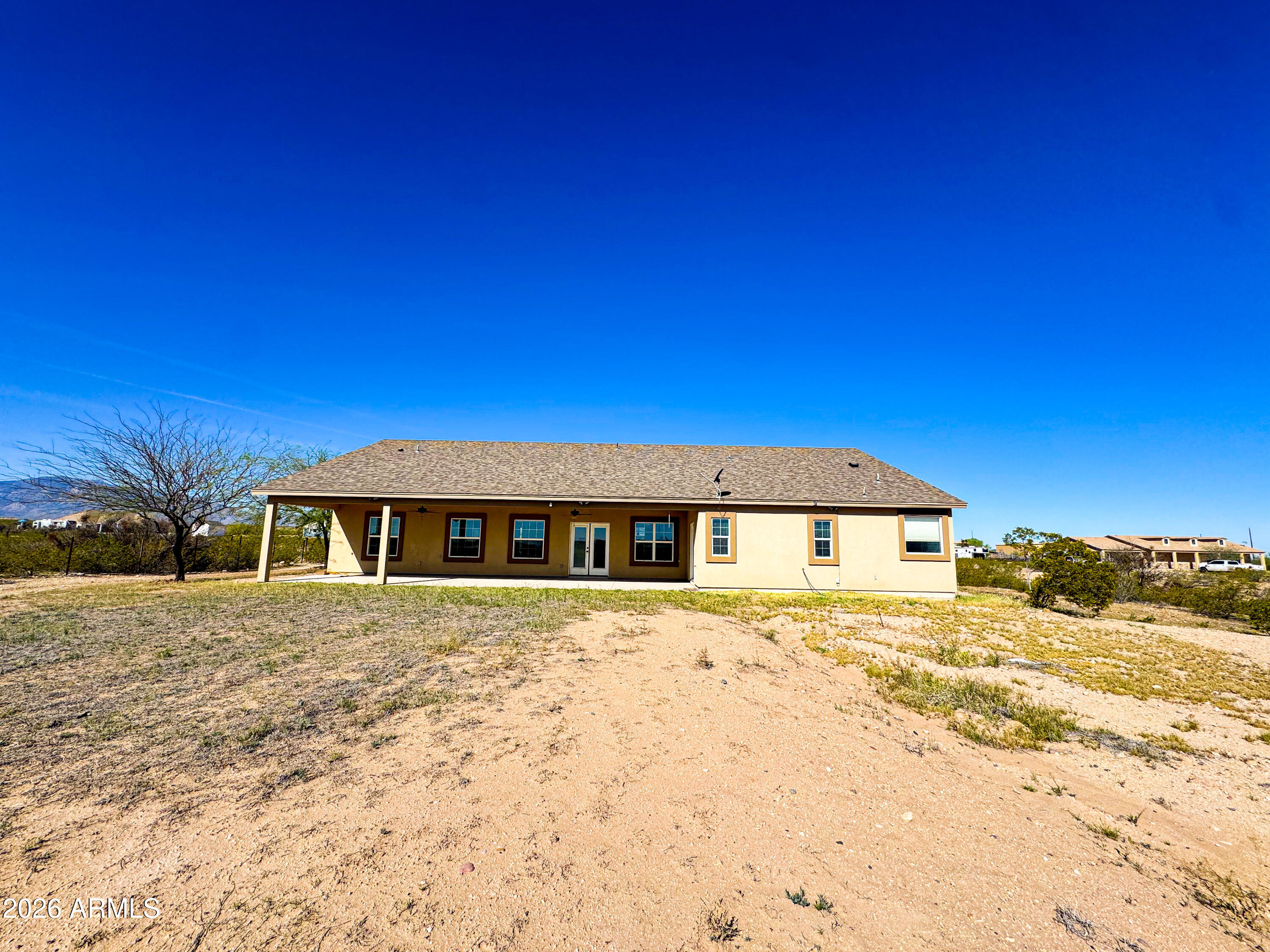 315 North 1720th Street West Pima, AZ 85543 - Photo 2 of 25 a view of a house with a yard