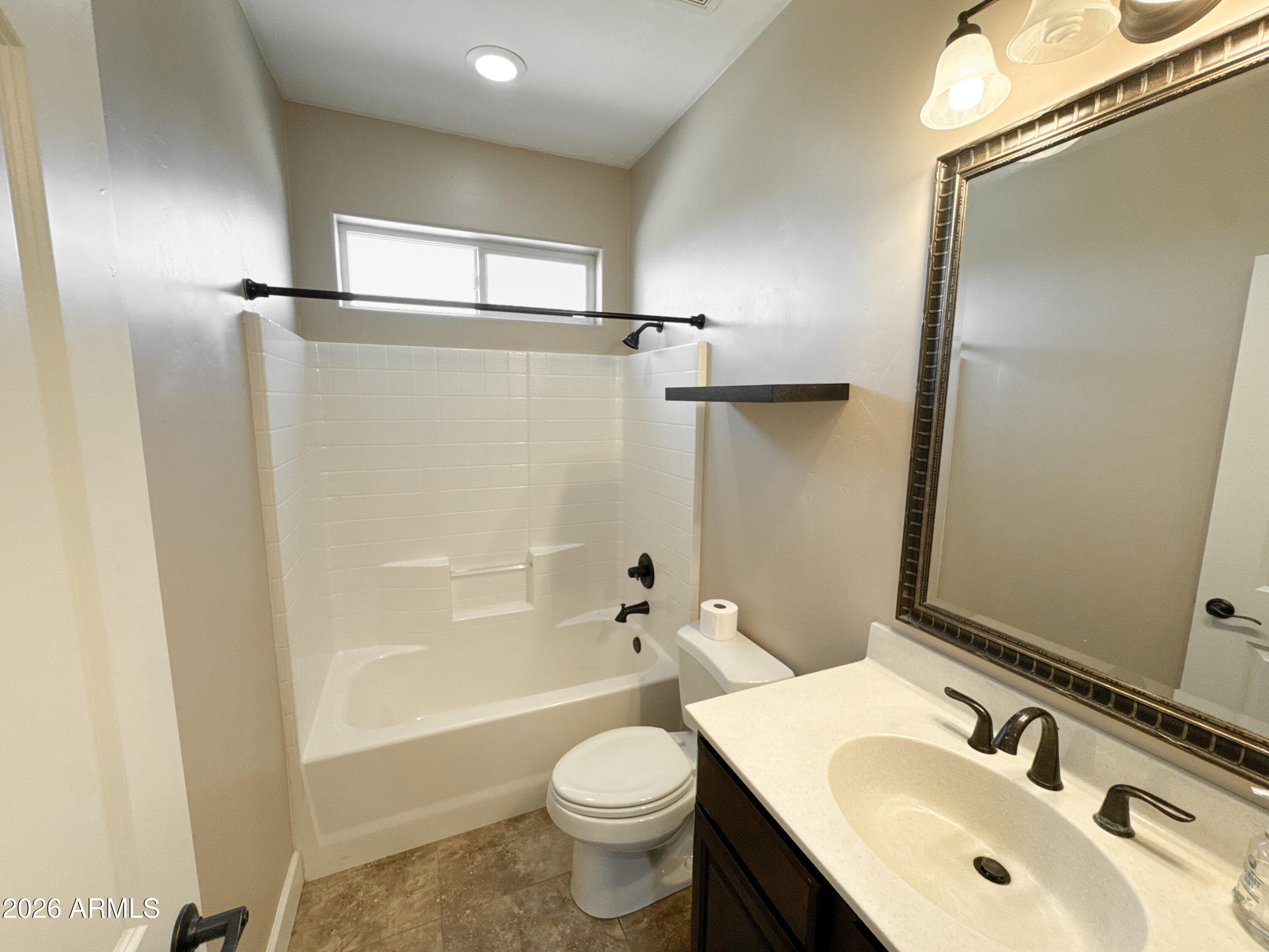 315 North 1720th Street West Pima, AZ 85543 - Photo 21 of 25 a bathroom with a sink toilet and shower