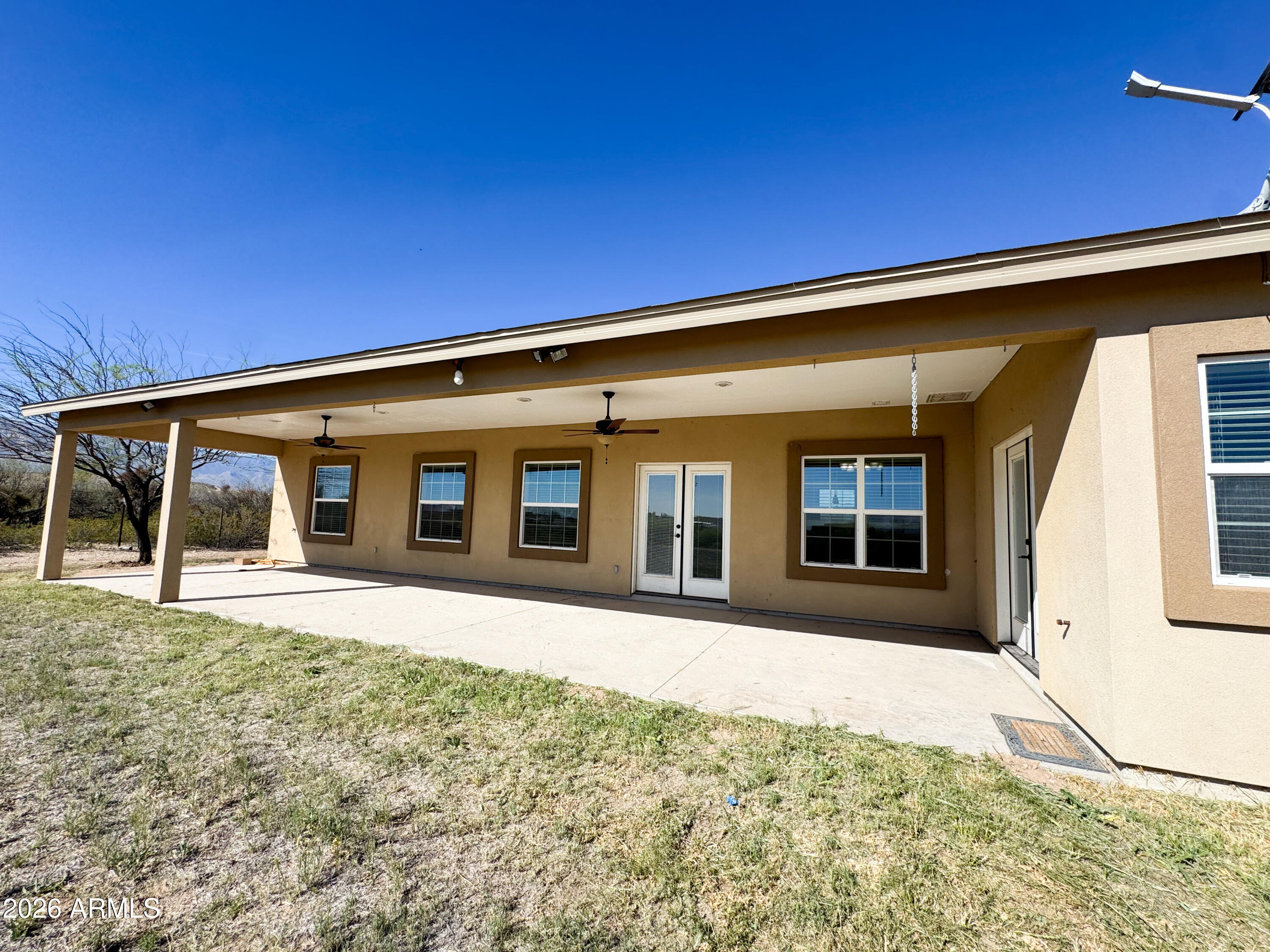 315 North 1720th Street West Pima, AZ 85543 - Photo 6 of 25 a front view of a house with a yard