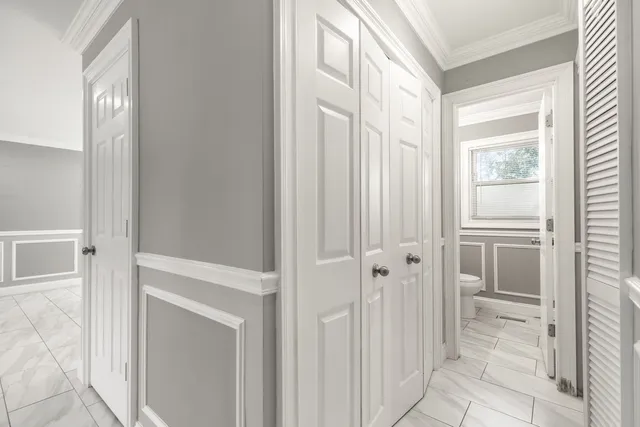 a view of an entryway with wooden floor