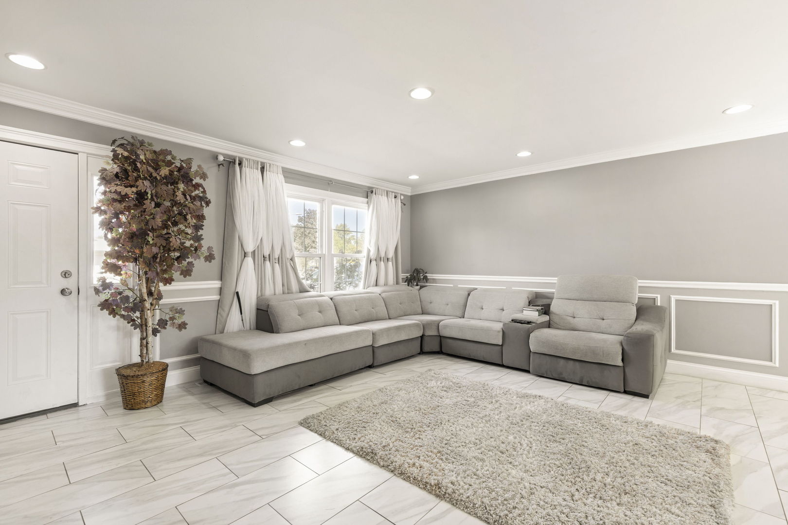 8181 Northway Drive Hanover Park, IL 60133 - Photo 6 of 23 a living room with furniture and a large window