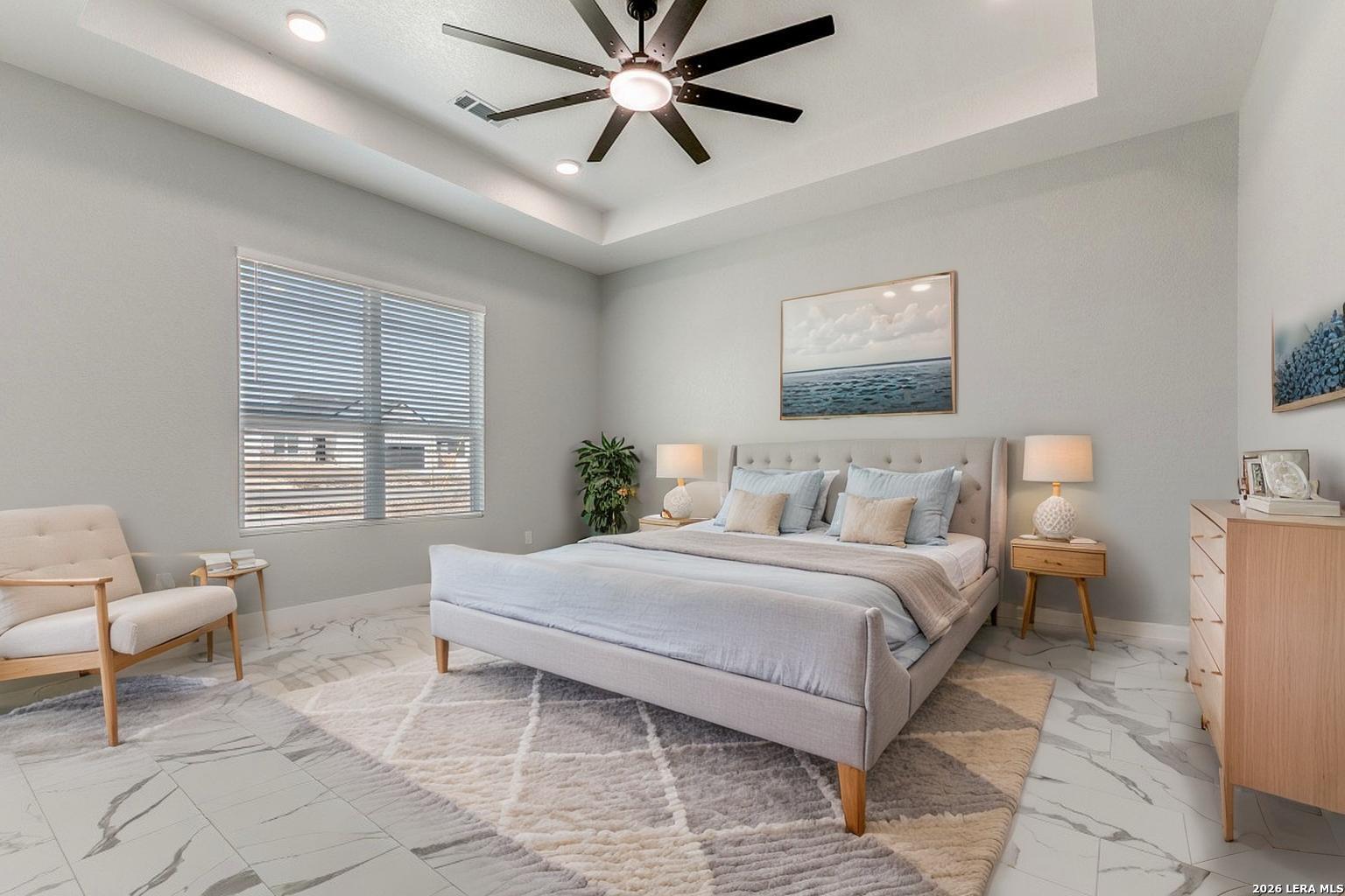 16934 Rancho Atascosa, TX 78002 - Photo 13 of 27 a spacious bedroom with a bed and a window