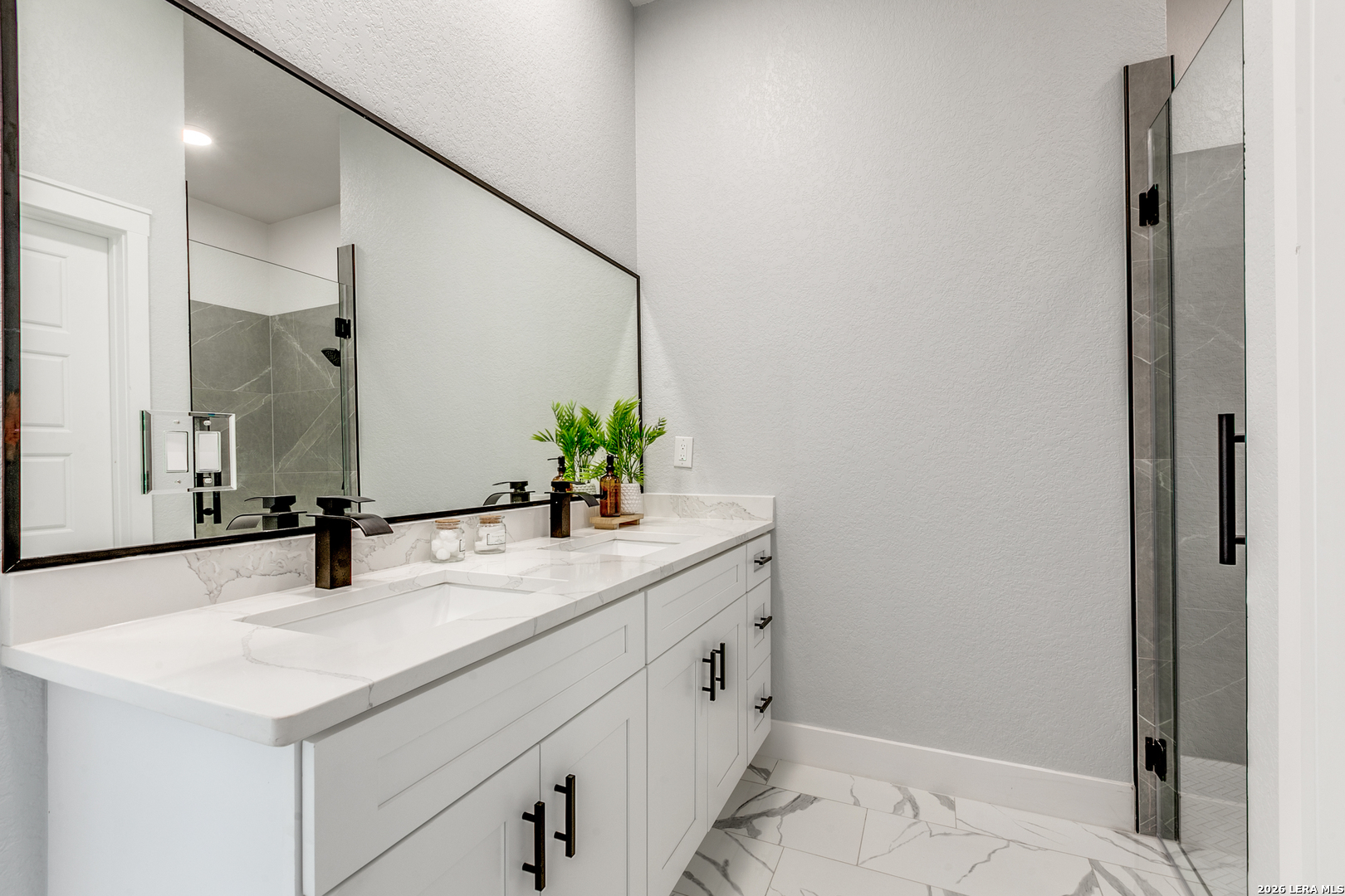 16934 Rancho Atascosa, TX 78002 - Photo 16 of 27 a bathroom with a sink and a mirror
