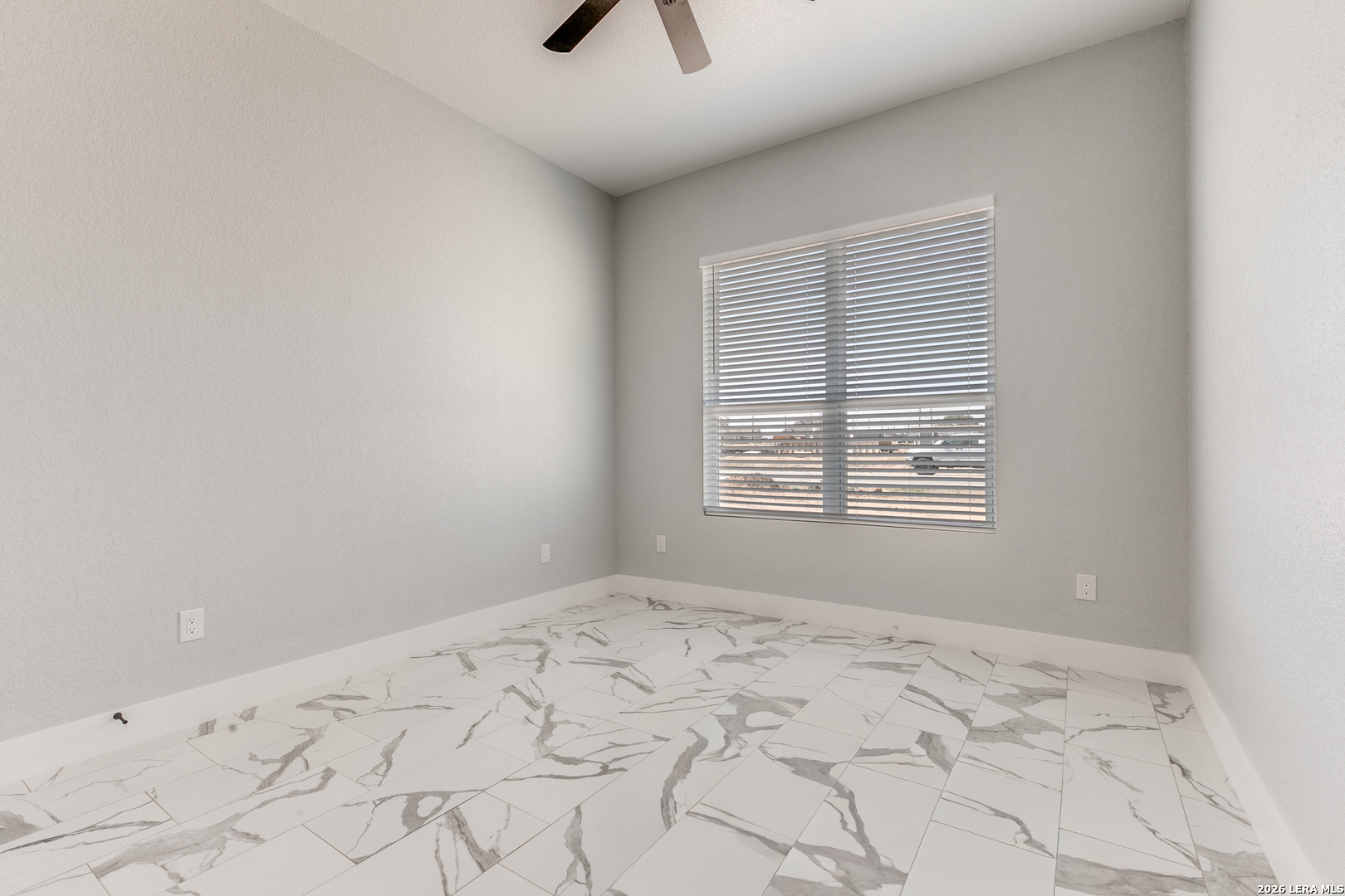 16934 Rancho Atascosa, TX 78002 - Photo 18 of 27 a view of empty room with window and ceiling fan