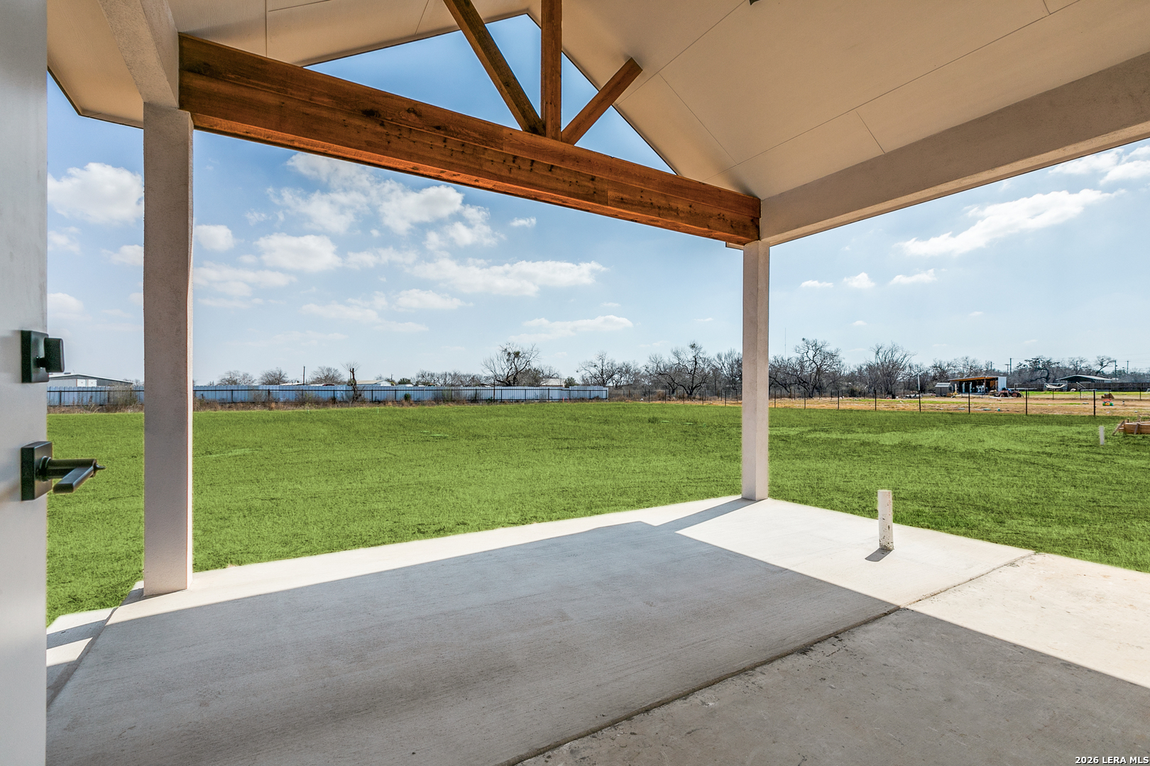 16934 Rancho Atascosa, TX 78002 - Photo 22 of 27 a view of a road with a big yard and potted plants