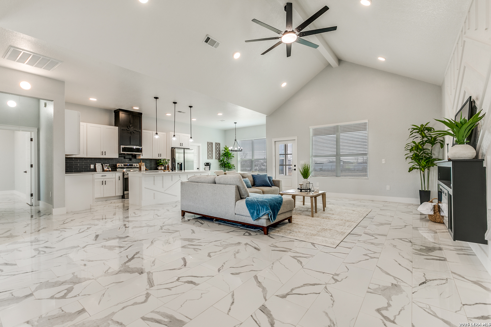 16934 Rancho Atascosa, TX 78002 - Photo 4 of 27 a living room with furniture and a kitchen view