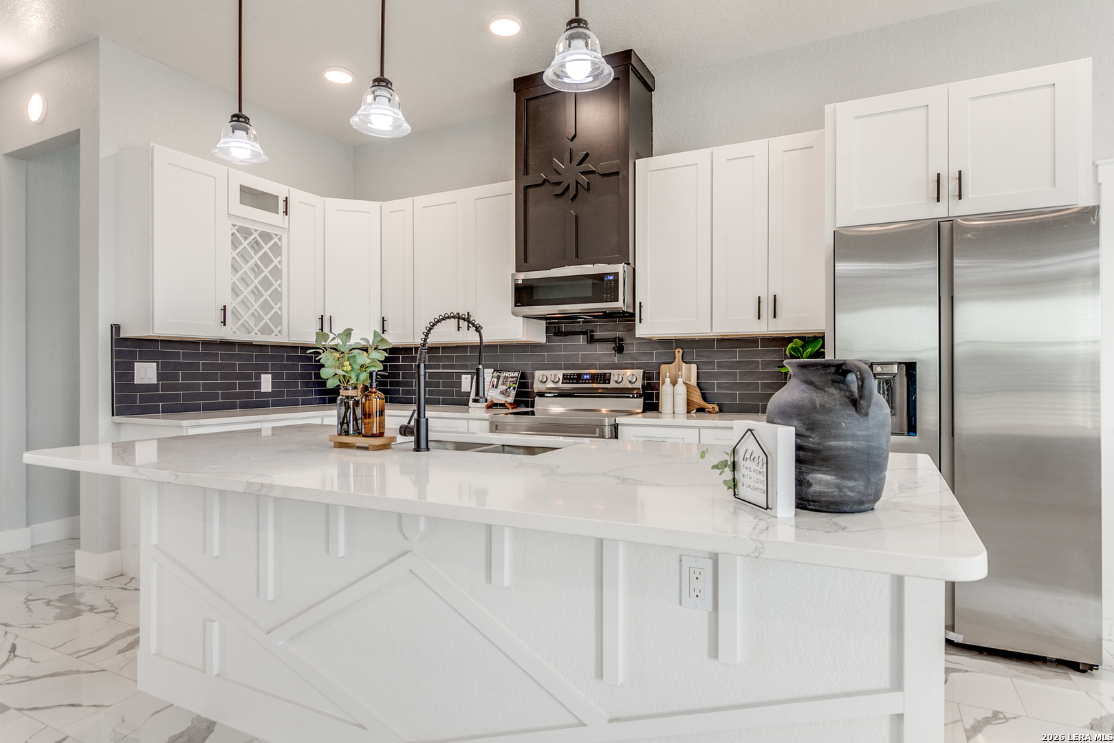 16934 Rancho Atascosa, TX 78002 - Photo 6 of 27 a kitchen with stainless steel appliances granite countertop a sink refrigerator and microwave