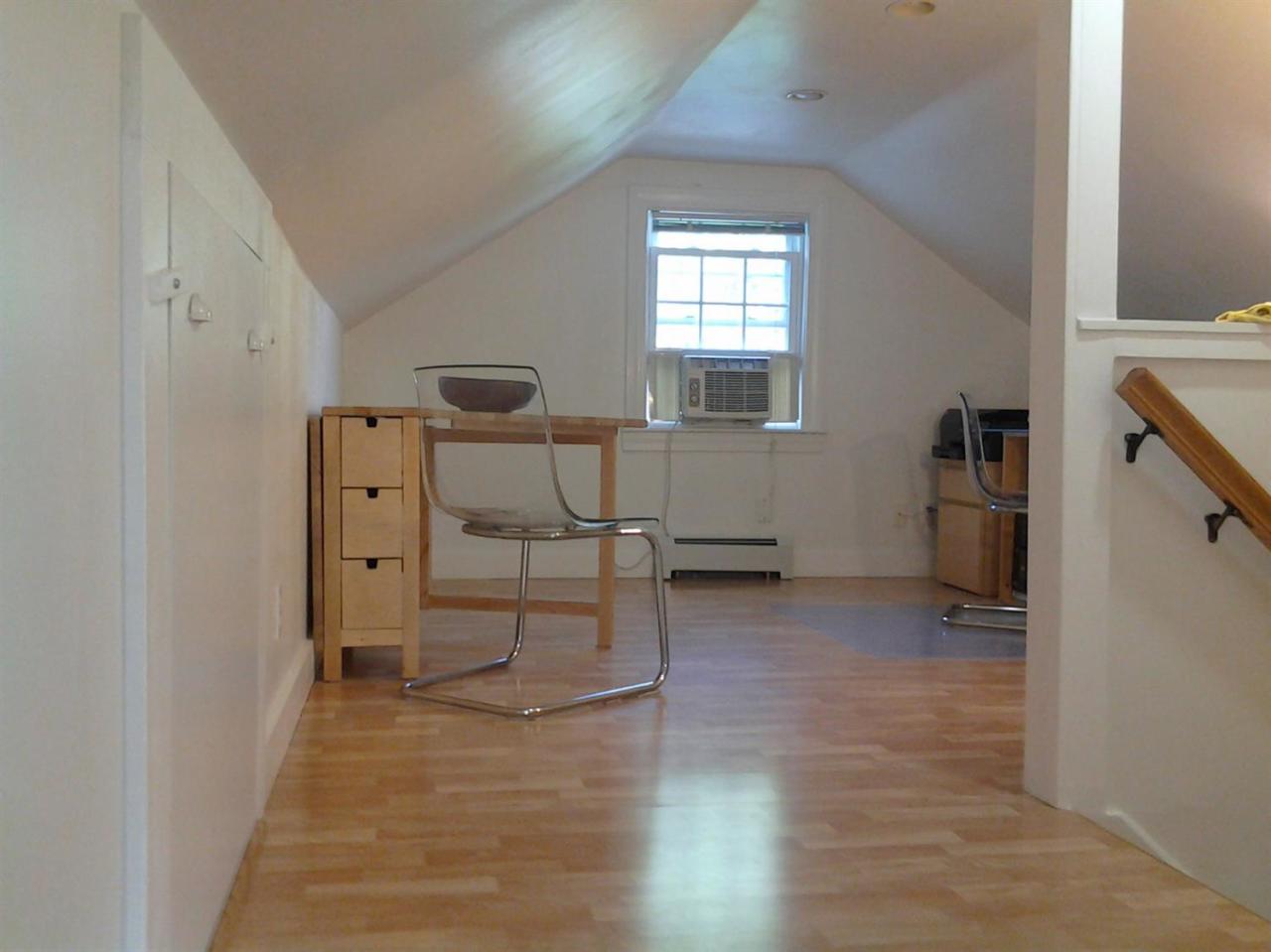 9 Clark Road Sagamore Beach, MA 02562 - Photo 20 of 27 a view of a livingroom with wooden furniture and windows