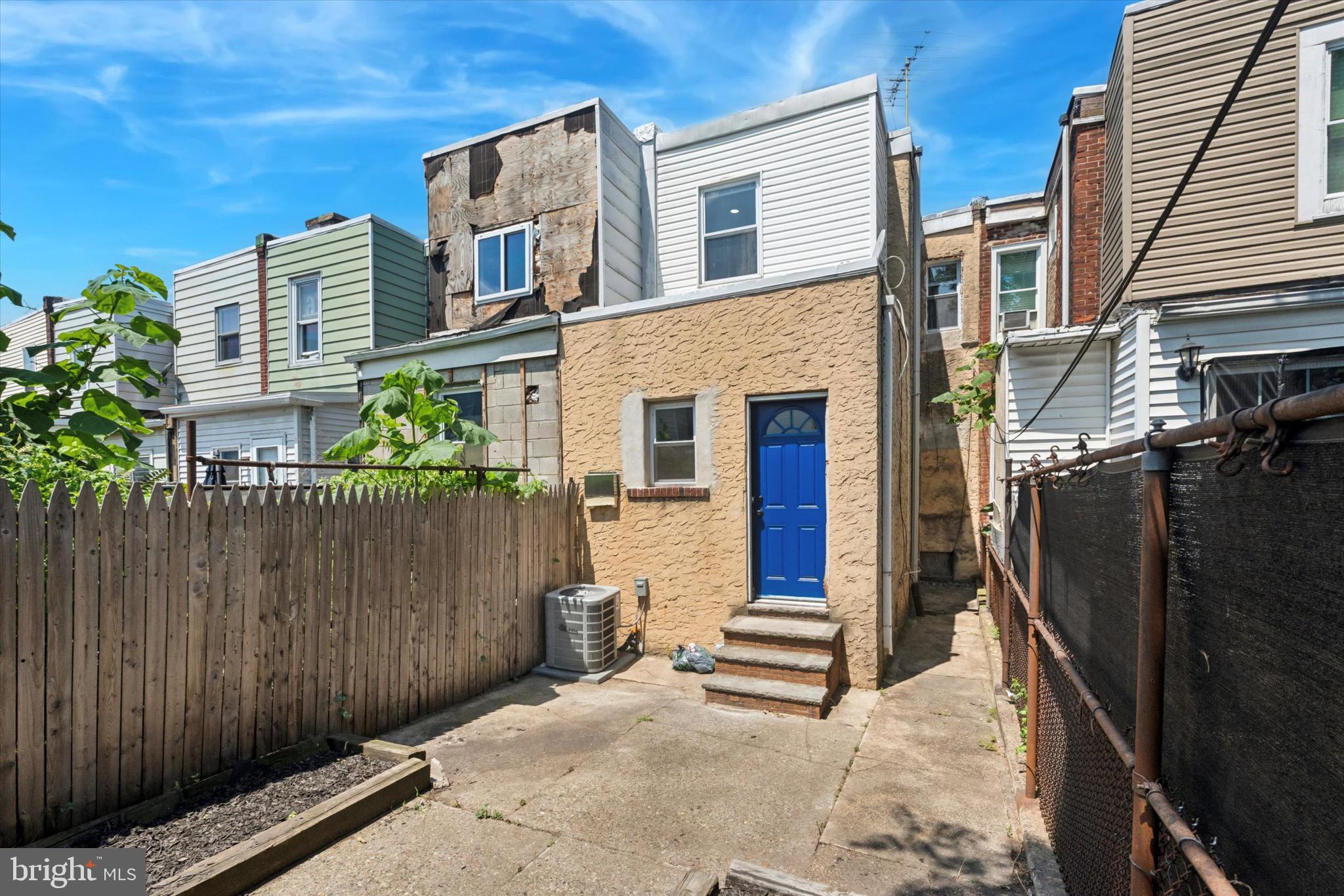 3097 Memphis Street Philadelphia, PA 19134 - Photo 11 of 18 a front view of a house with a garage