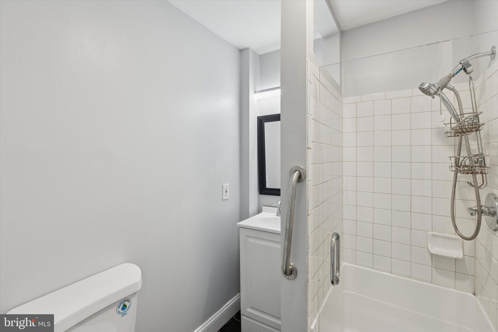 3097 Memphis Street Philadelphia, PA 19134 - Photo 13 of 18 a bathroom with a shower and toilet