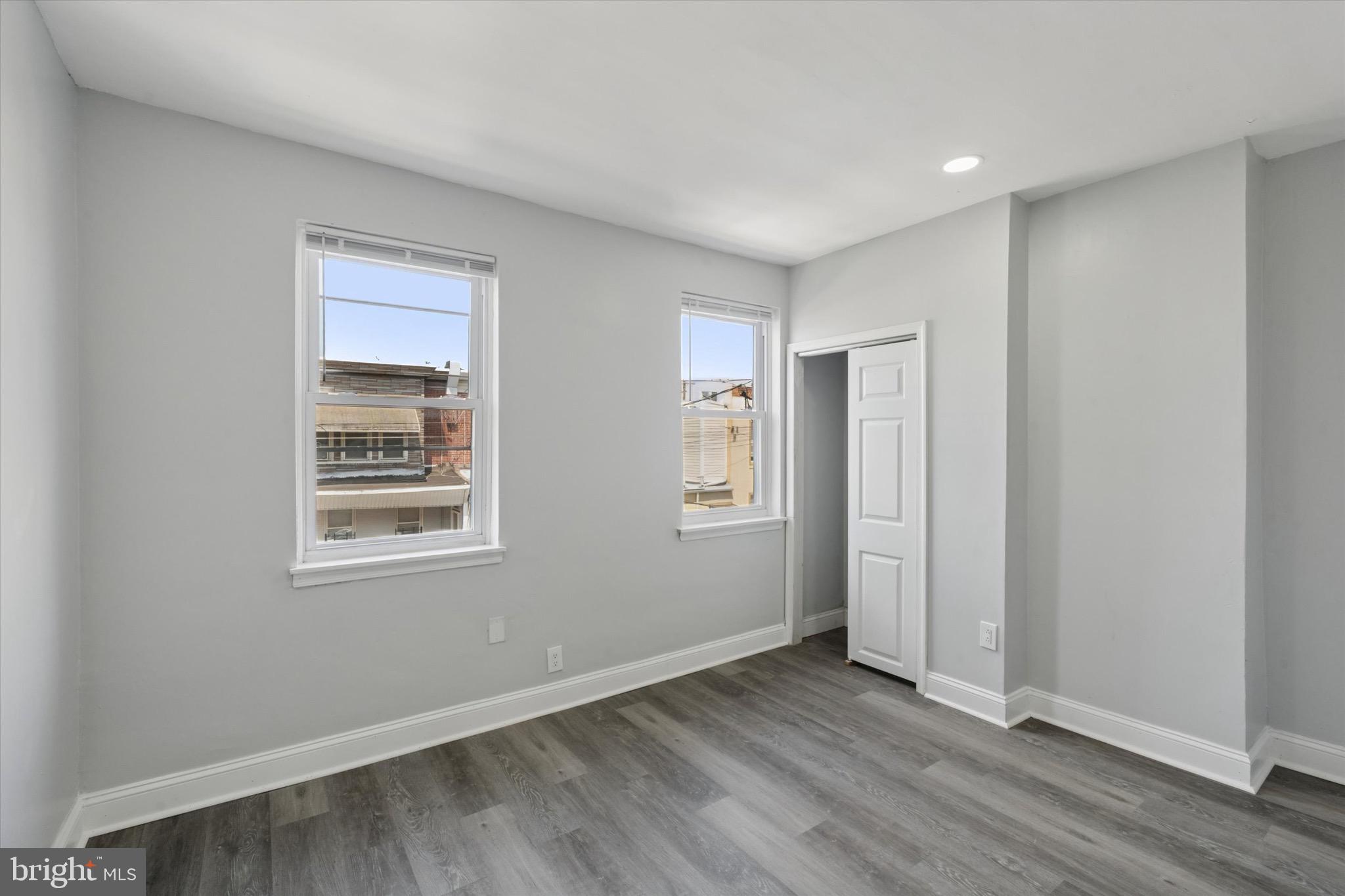 3097 Memphis Street Philadelphia, PA 19134 - Photo 17 of 18 an empty room with wooden floor and windows