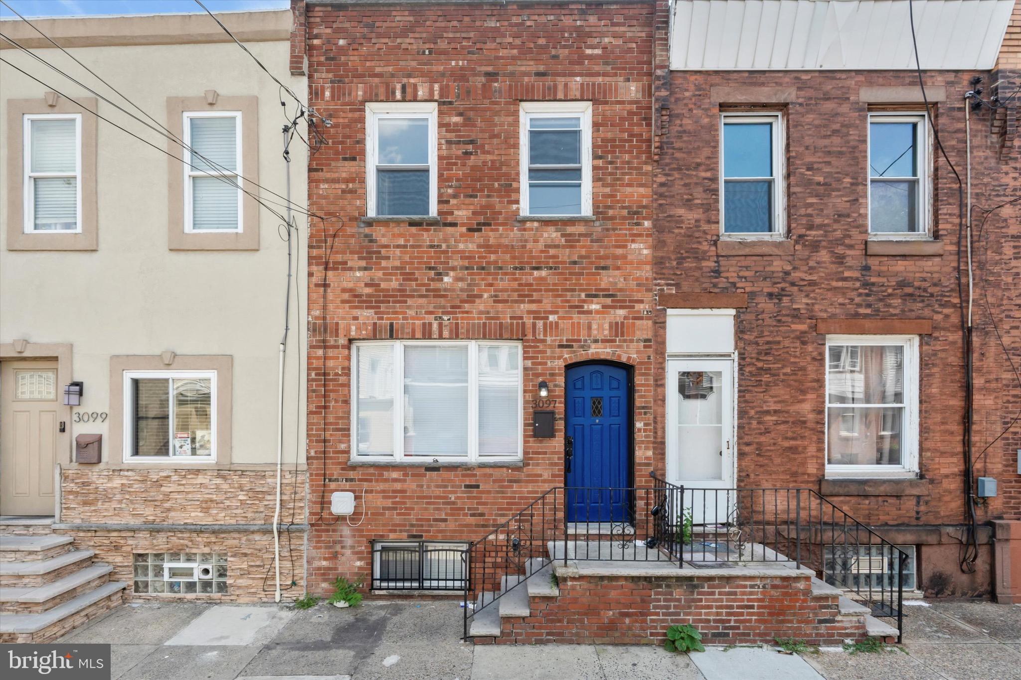 3097 Memphis Street Philadelphia, PA 19134 - Photo 4 of 18 a front view of a house with a yard
