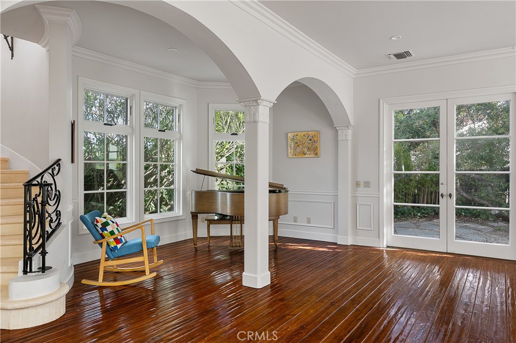 21149 Entrada Road Topanga, CA 90290 - Photo 11 of 39 a living room with wooden floor and windows