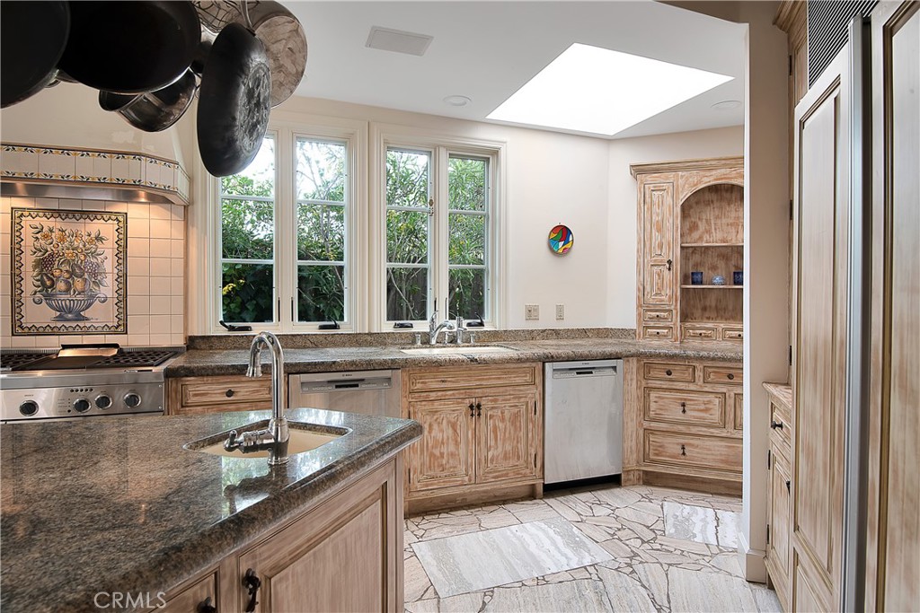 21149 Entrada Road Topanga, CA 90290 - Photo 15 of 39 a kitchen with a sink and large window
