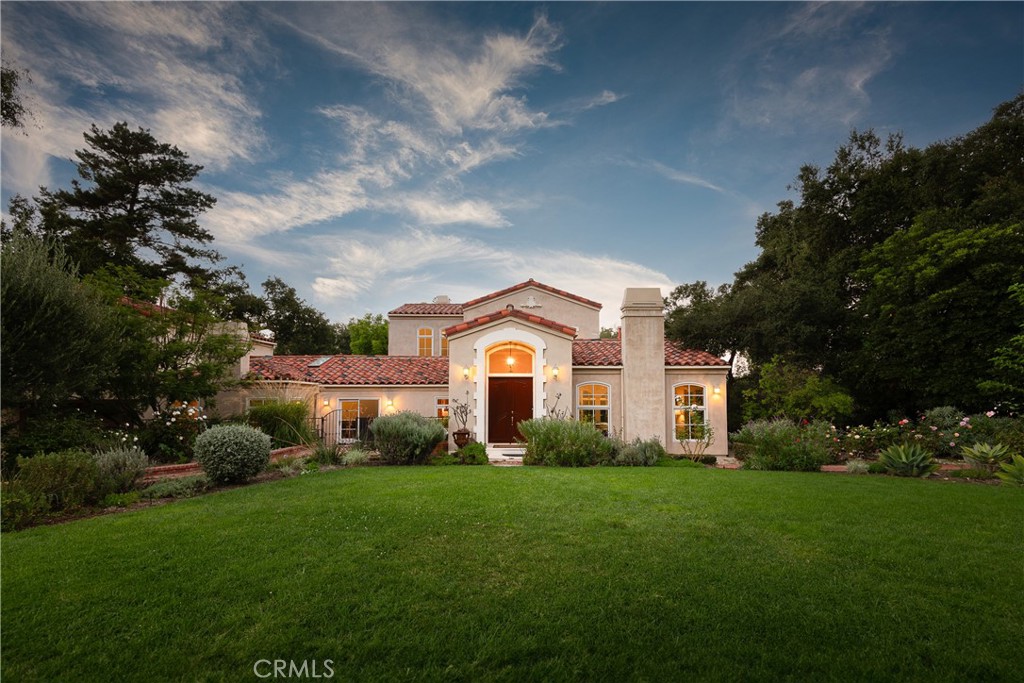 21149 Entrada Road Topanga, CA 90290 - Photo 2 of 39 a front view of a house with a garden