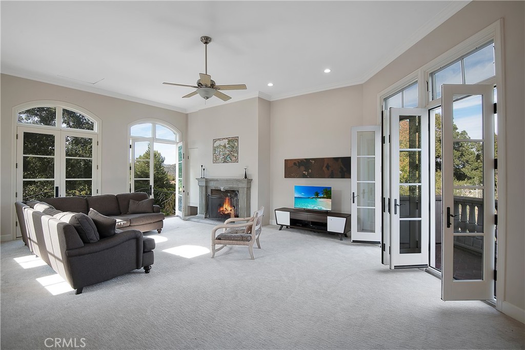 21149 Entrada Road Topanga, CA 90290 - Photo 22 of 39 a living room with furniture and a fireplace