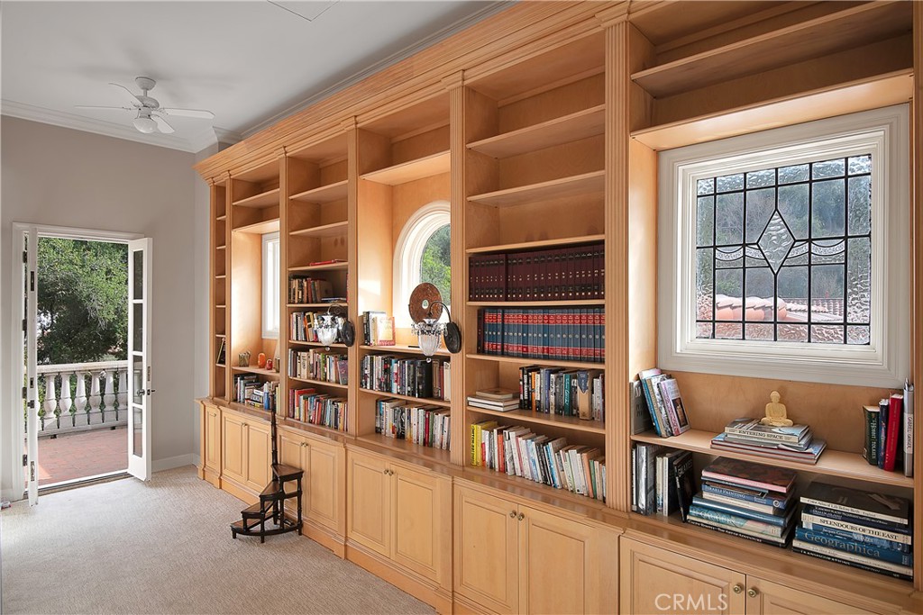 21149 Entrada Road Topanga, CA 90290 - Photo 25 of 39 a room with lots of furniture and a book shelf