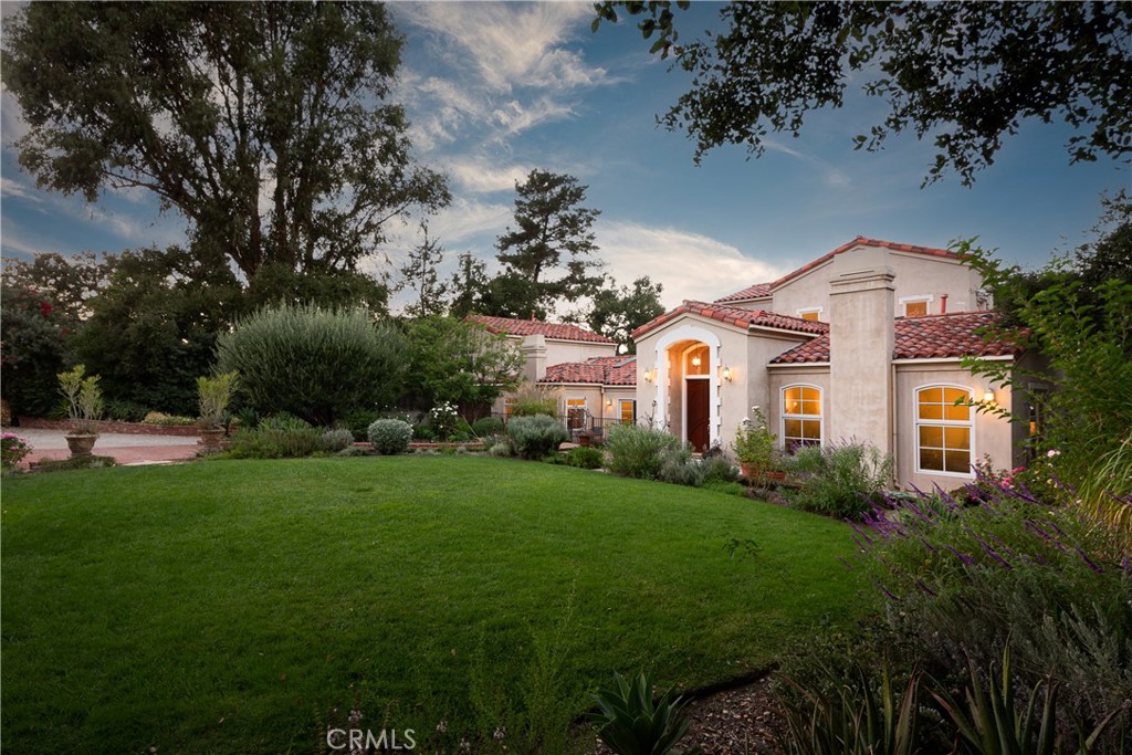 21149 Entrada Road Topanga, CA 90290 - Photo 31 of 39 a front view of a house with a yard
