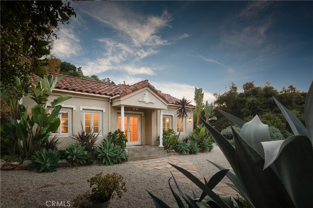 21149 Entrada Road Topanga, CA 90290 - Photo 32 of 39 a front view of a house with garden