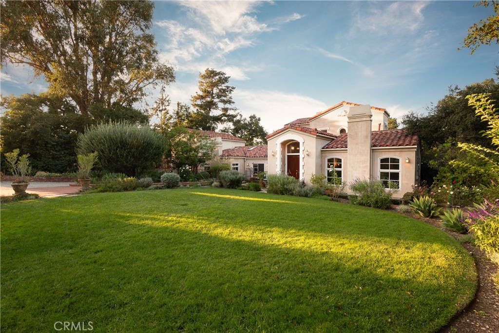 21149 Entrada Road Topanga, CA 90290 - Photo 5 of 39 a front view of a house with garden