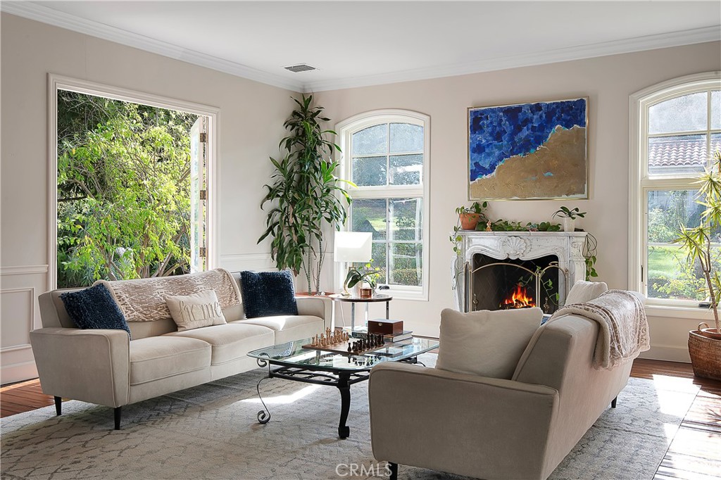 21149 Entrada Road Topanga, CA 90290 - Photo 9 of 39 a living room with furniture fireplace and a large window