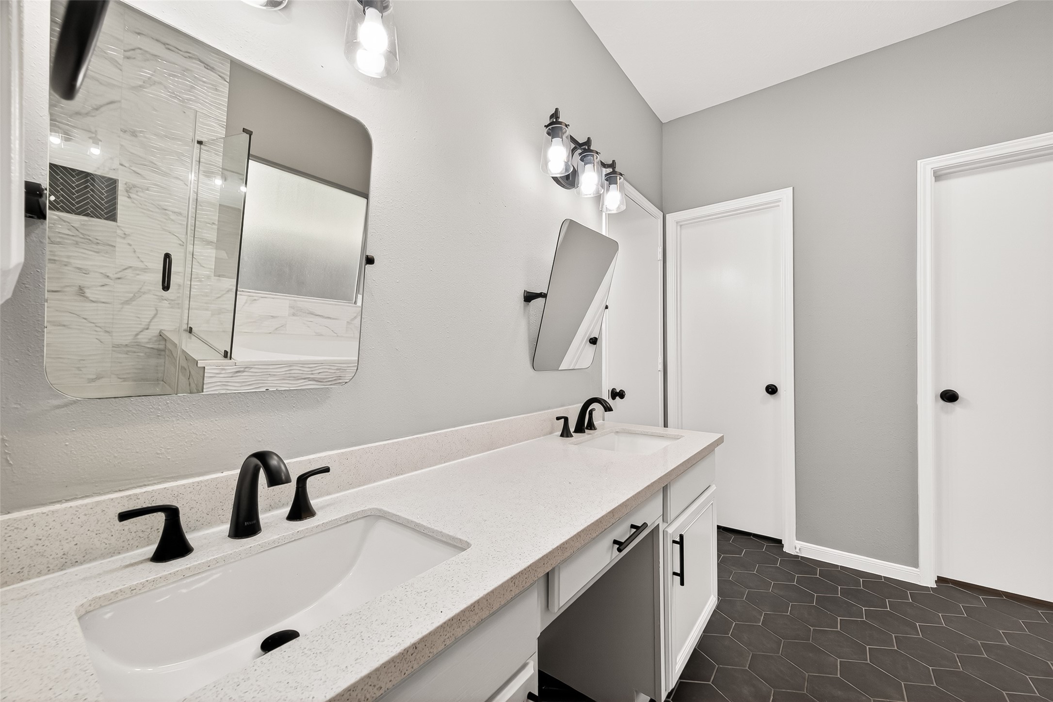 23810 Spring Way Drive Spring, TX 77373 - Photo 20 of 35 a bathroom with a sink vanity and mirror