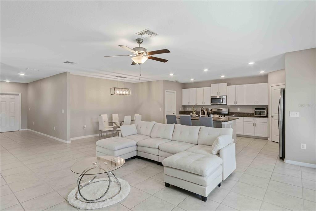 9440 Lemon Drop Loop Sun City Center, FL 33573 - Photo 22 of 55 a living room with furniture and kitchen view