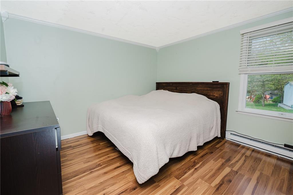 67 Prides Way Seward, PA 15954 - Photo 24 of 29 a bedroom with a bed and wooden floor